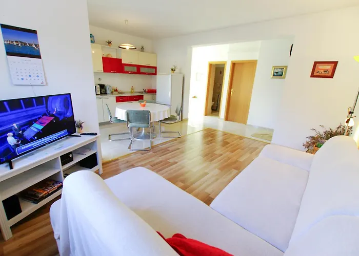 House With Garden And Barbecue Grill In